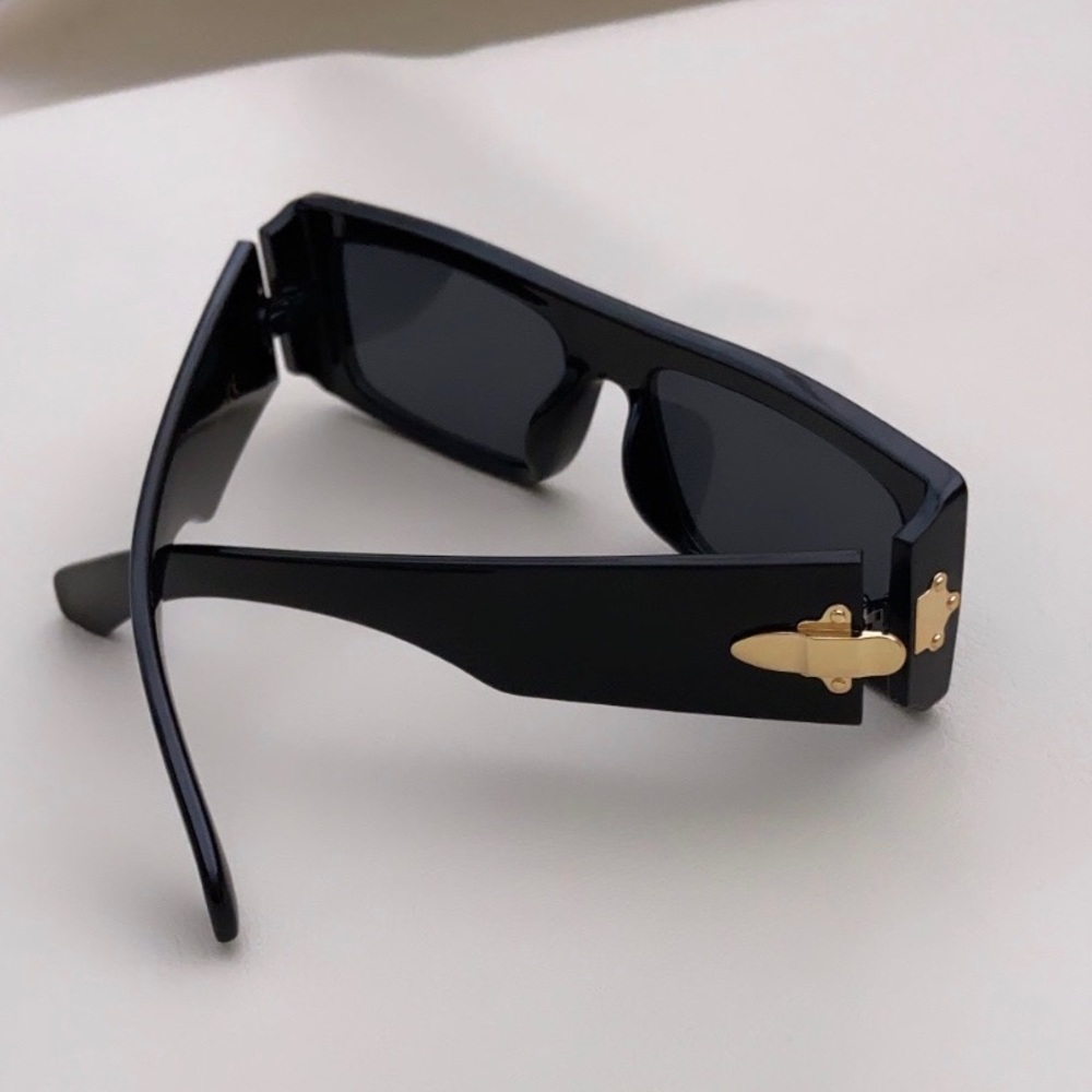 Black square frame sunglasses with gold hardware